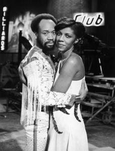 Promotional portrait of American singers Maurice White Natalie Cole embracing for Cole's television special, 1978. (Photo by Frank Edwards/Fotos International/Getty Images)